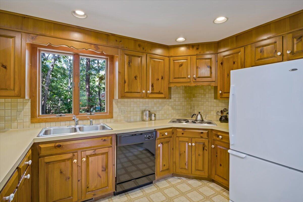 45 Danielle Drive Eastham, MA 02642 - Photo 6 of 42 a kitchen with a sink a refrigerator and window