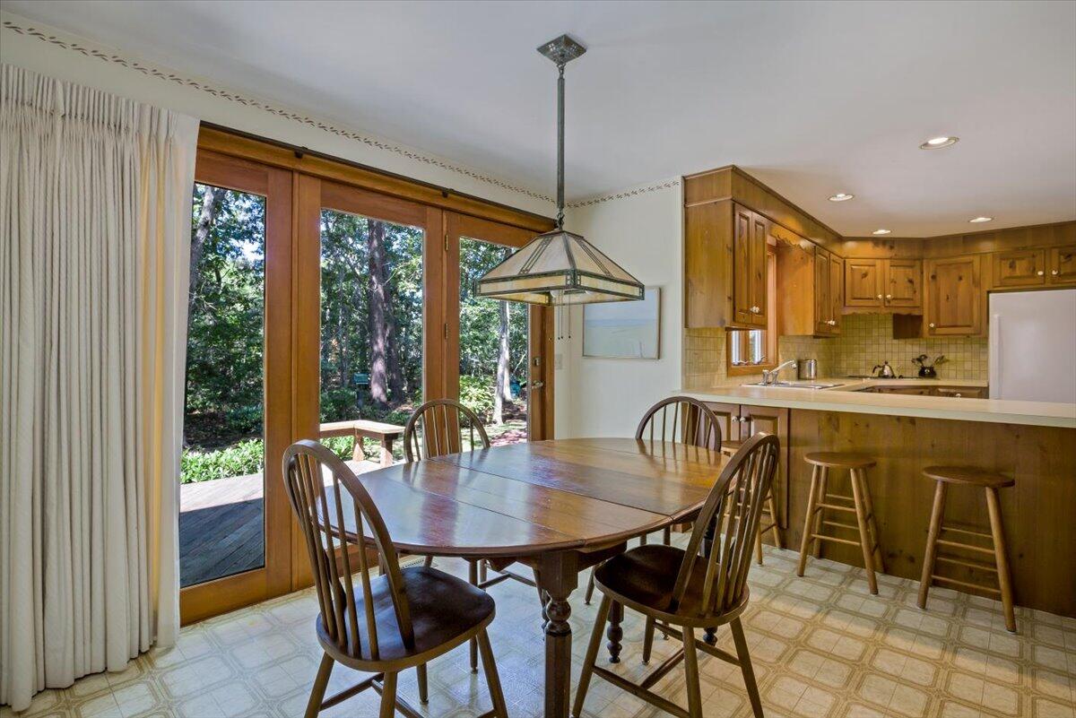45 Danielle Drive Eastham, MA 02642 - Photo 10 of 42 a dining room with furniture a chandelier and window