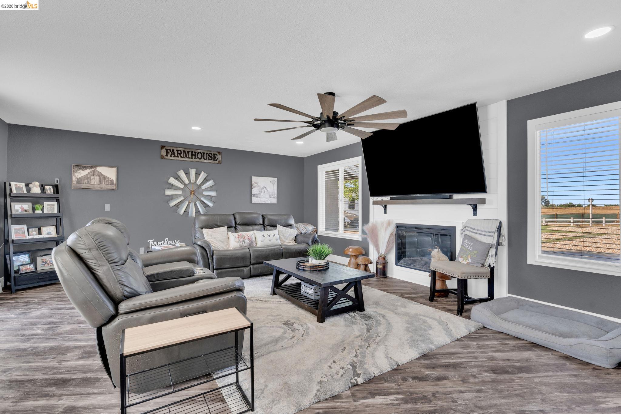 59 Old Stagecoach Road Brentwood, CA 94513 - Photo 15 of 70 Spacious living area featuring wood-finish flooring and a ceiling fan