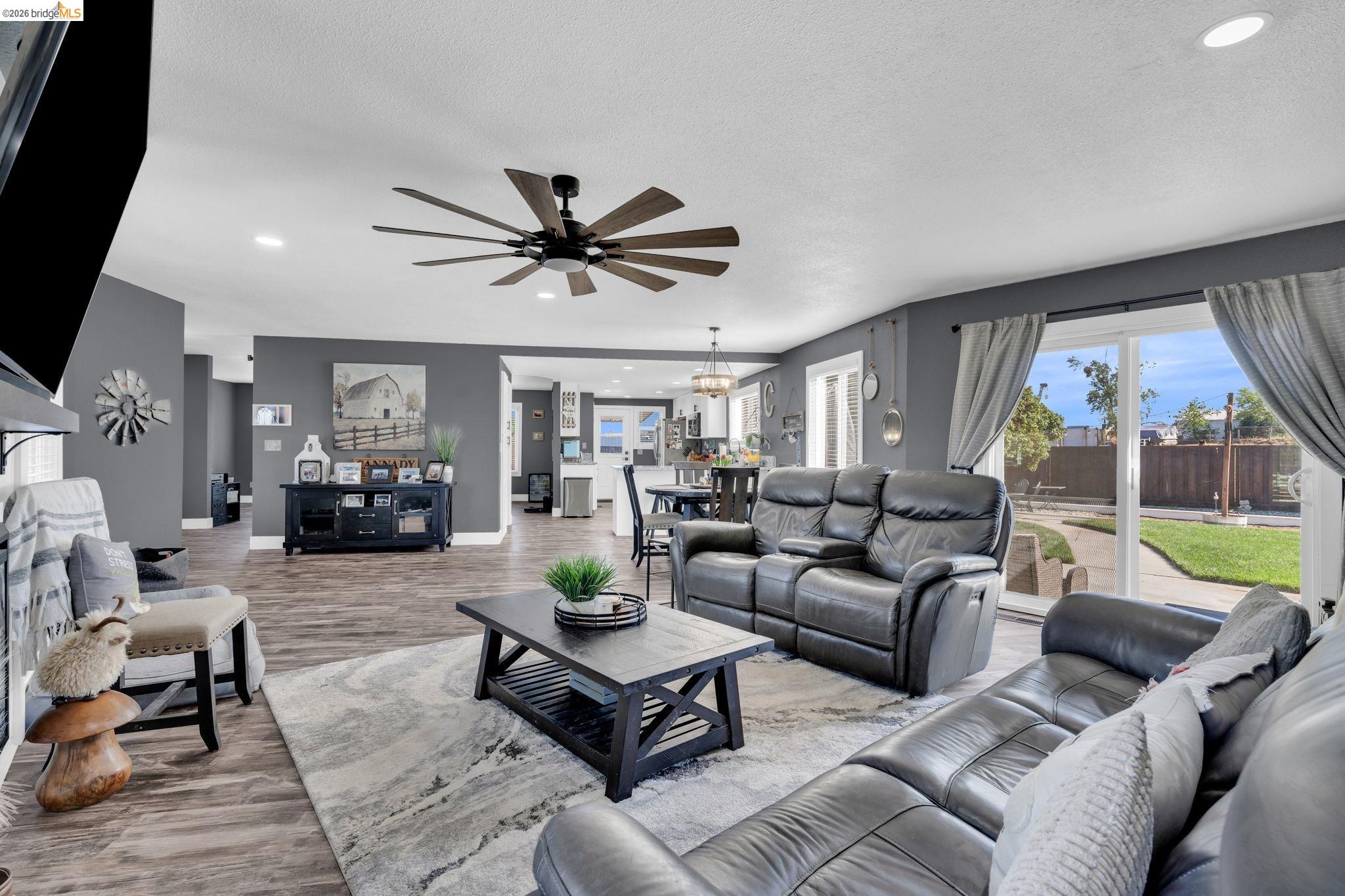 59 Old Stagecoach Road Brentwood, CA 94513 - Photo 16 of 70 Spacious living area featuring wood-finish flooring, recessed lighting, and a multi-blade ceiling fan