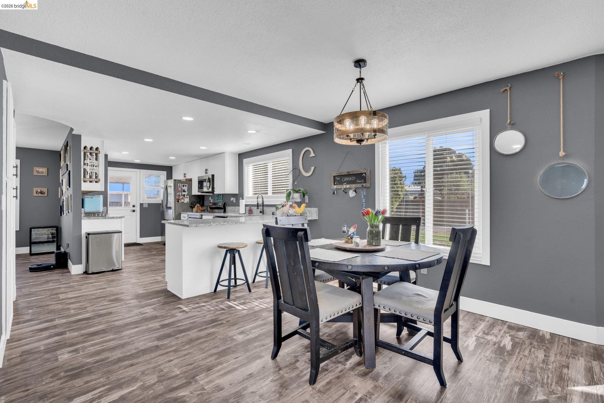 59 Old Stagecoach Road Brentwood, CA 94513 - Photo 17 of 70 Open-concept living space featuring wood-finish flooring, a modern chandelier, and recessed lighting
