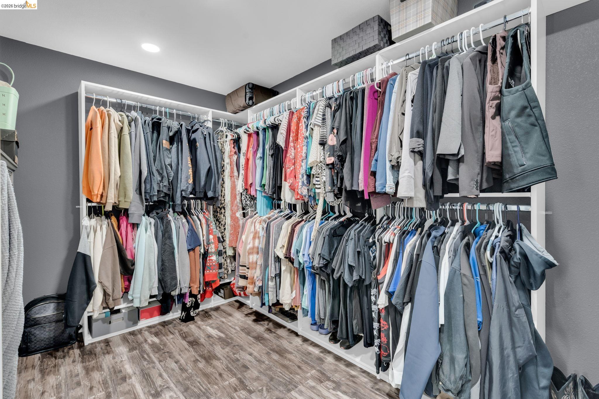 59 Old Stagecoach Road Brentwood, CA 94513 - Photo 30 of 70 Custom closet system featuring white shelving and multiple hanging rods