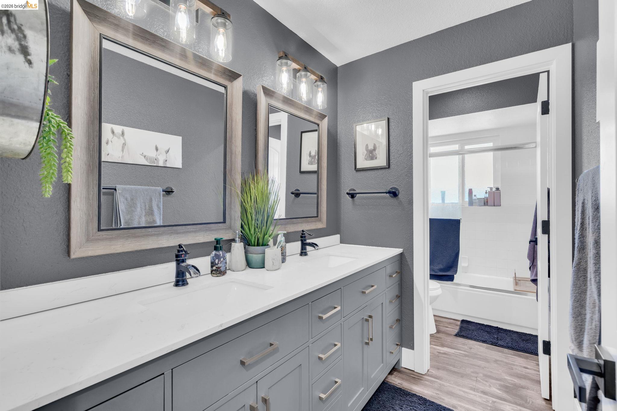 59 Old Stagecoach Road Brentwood, CA 94513 - Photo 37 of 70 Dual vanity with white countertop, undermount sinks, and matte black faucets