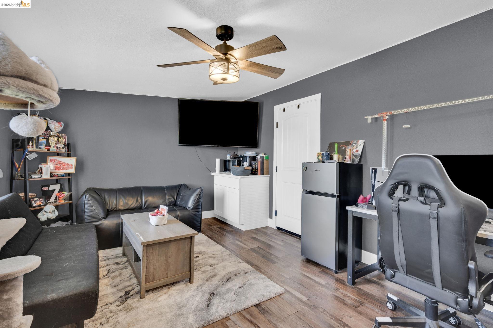 59 Old Stagecoach Road Brentwood, CA 94513 - Photo 43 of 70 Spacious room featuring wood-finish flooring, a ceiling fan with integrated lighting, and a white paneled door