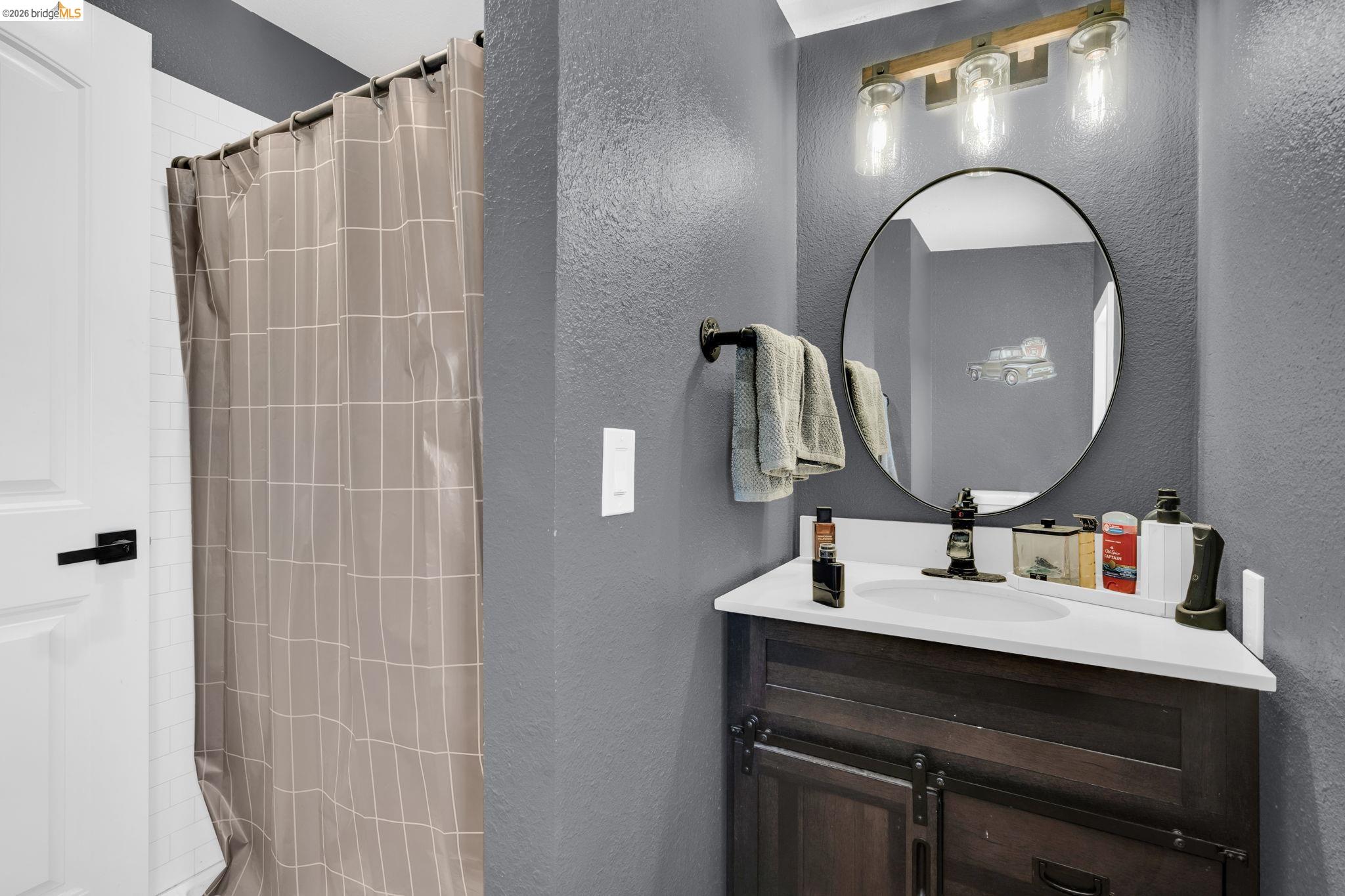 59 Old Stagecoach Road Brentwood, CA 94513 - Photo 45 of 70 Bathroom featuring a dark wood-finish vanity with a white countertop and integrated sink