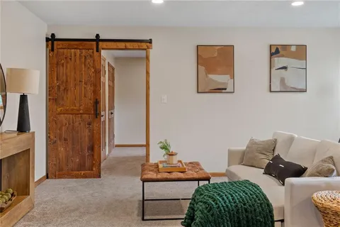 a bedroom with furniture and a window