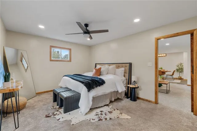 a bedroom with a bed and a mirror