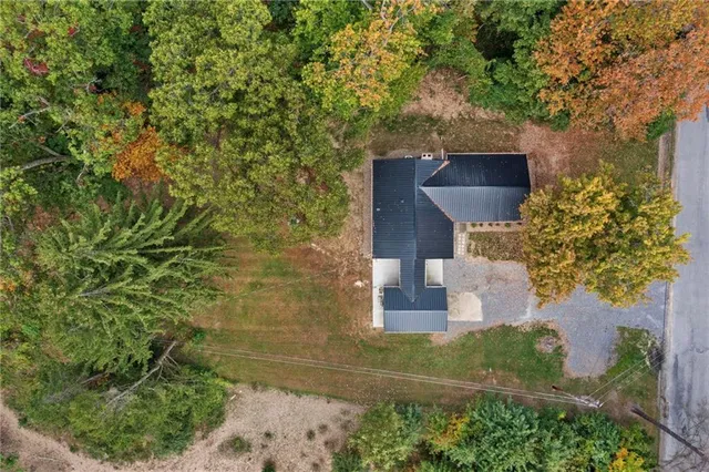 a aerial view of a house with a yard