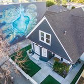 a aerial view of a house with a yard