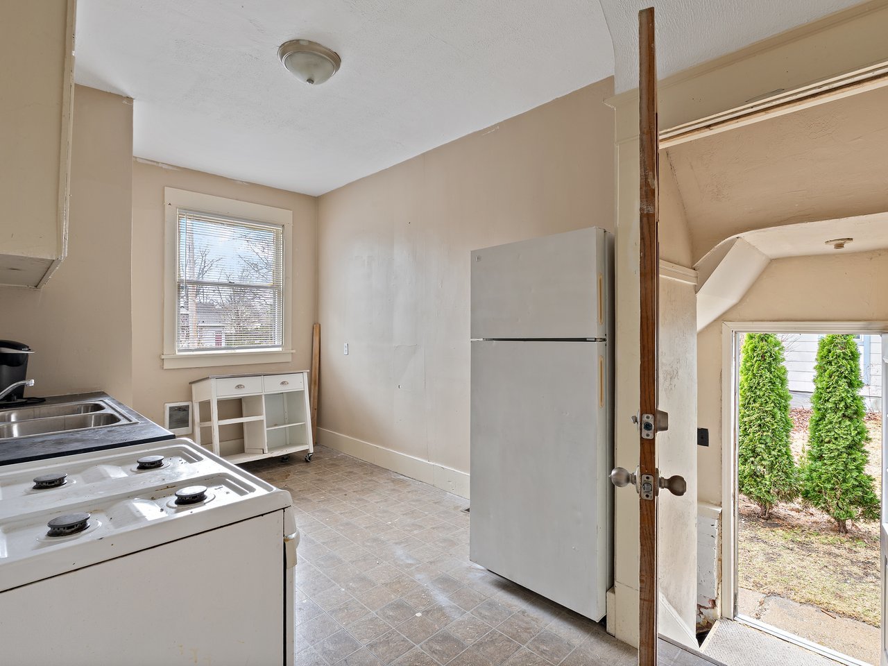 1546 12th Avenue Moline, IL 61265 - Photo 17 of 32 a kitchen that has a stove and a refrigerator