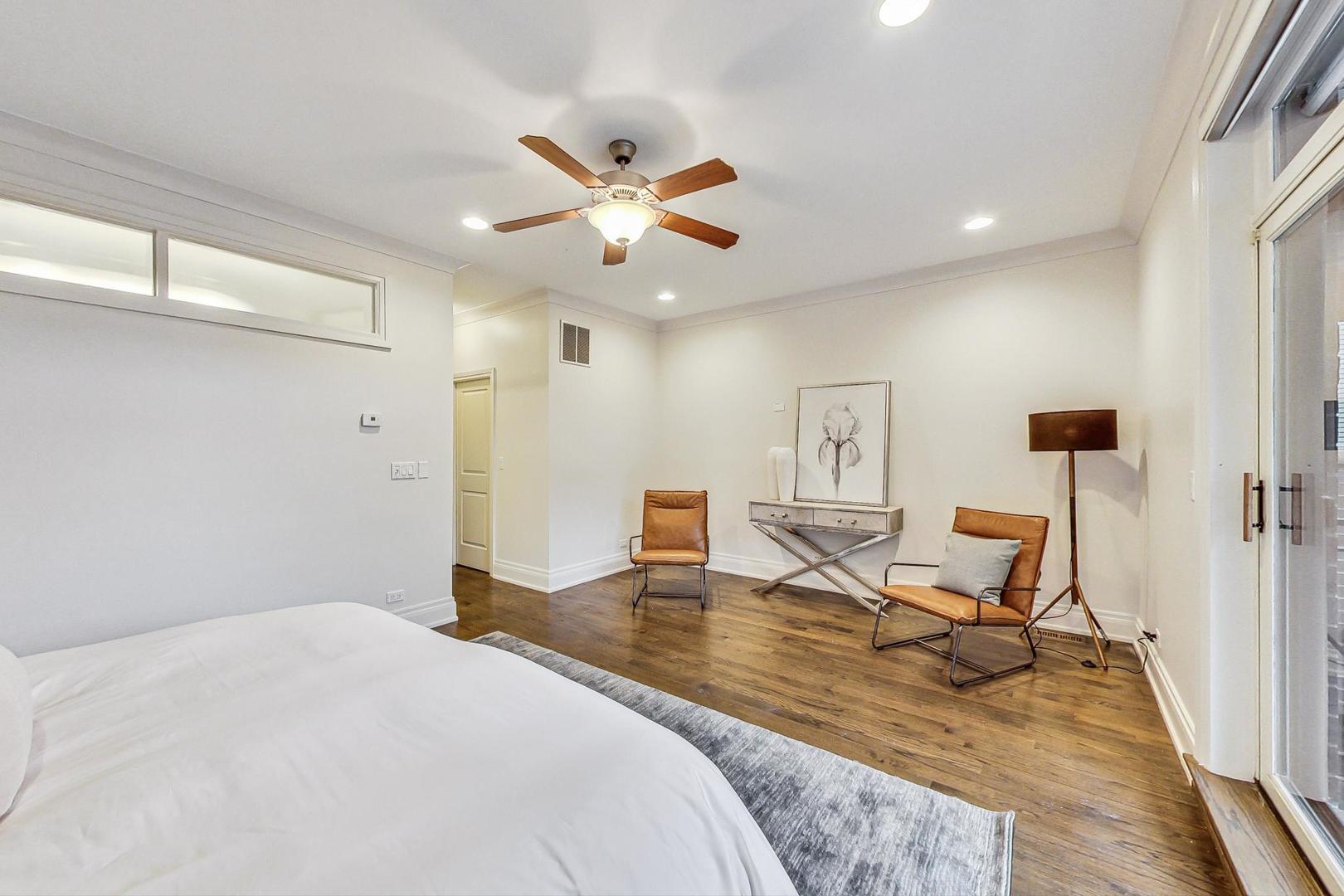 2848 North Sheffield Avenue, Unit 1N Chicago, IL 60657 - Photo 19 of 40 a bedroom with a bed and wooden floor