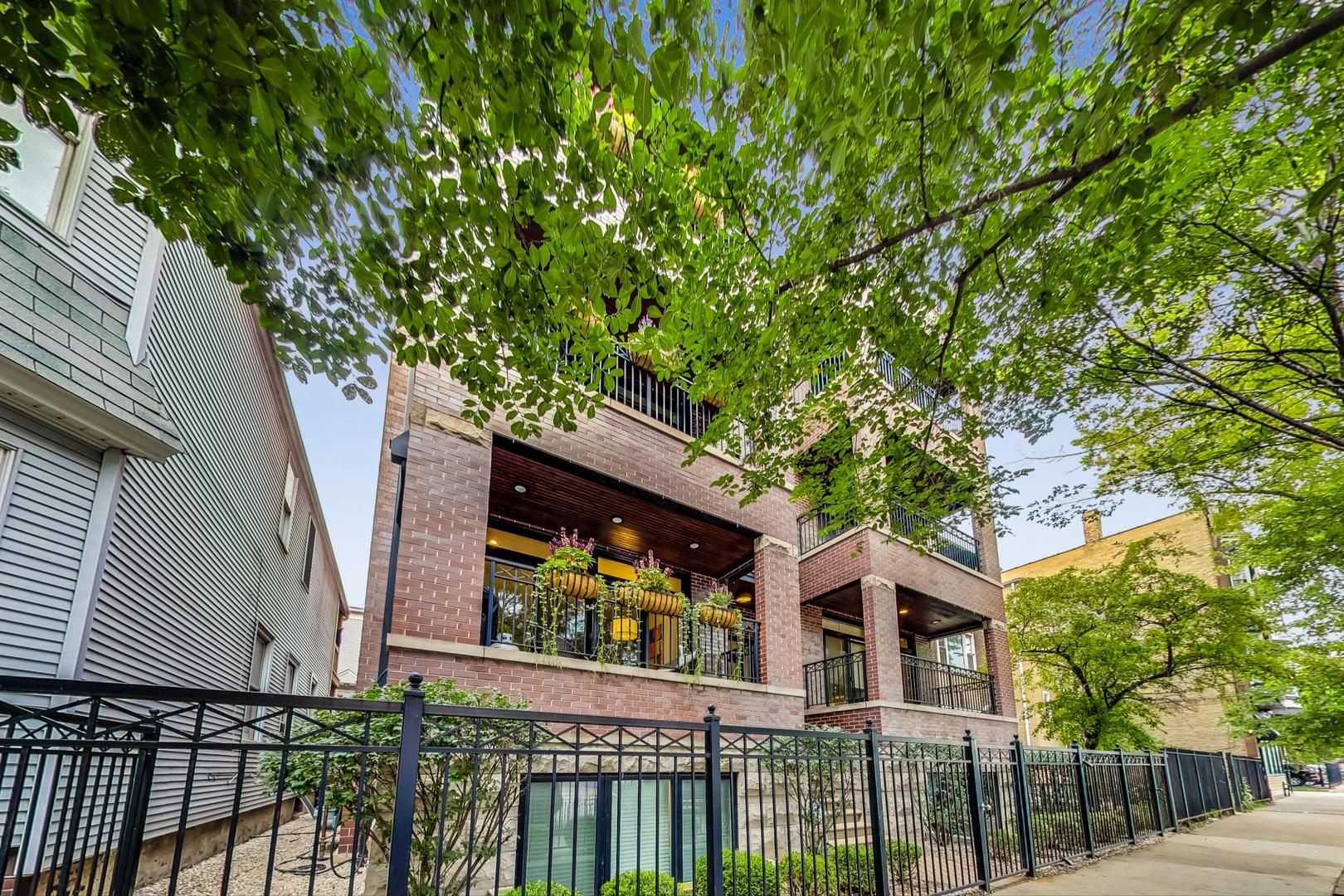 2848 North Sheffield Avenue, Unit 1N Chicago, IL 60657 - Photo 2 of 40 a front view of a house with a tree