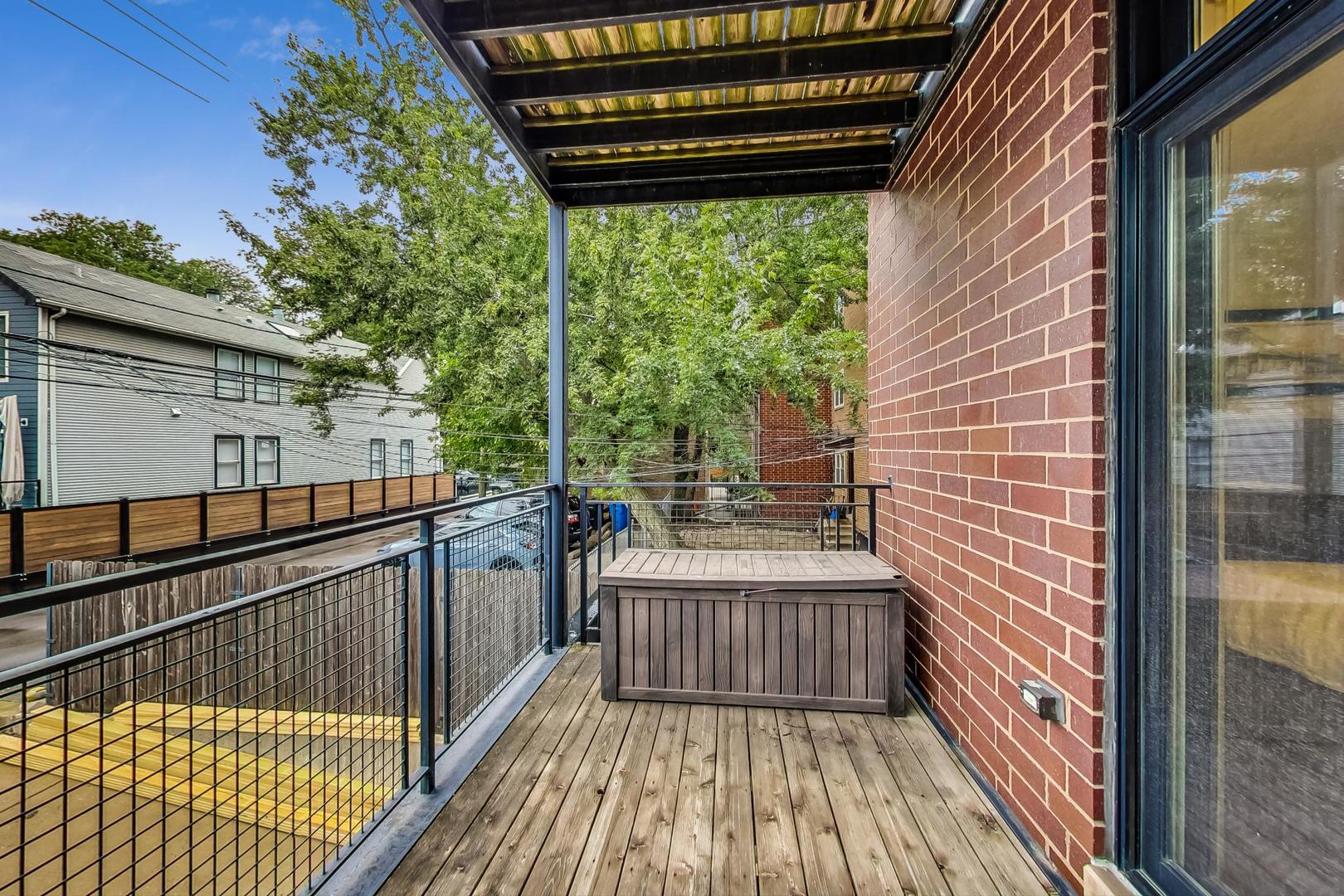 2848 North Sheffield Avenue, Unit 1N Chicago, IL 60657 - Photo 21 of 40 a view of a balcony with wooden floor