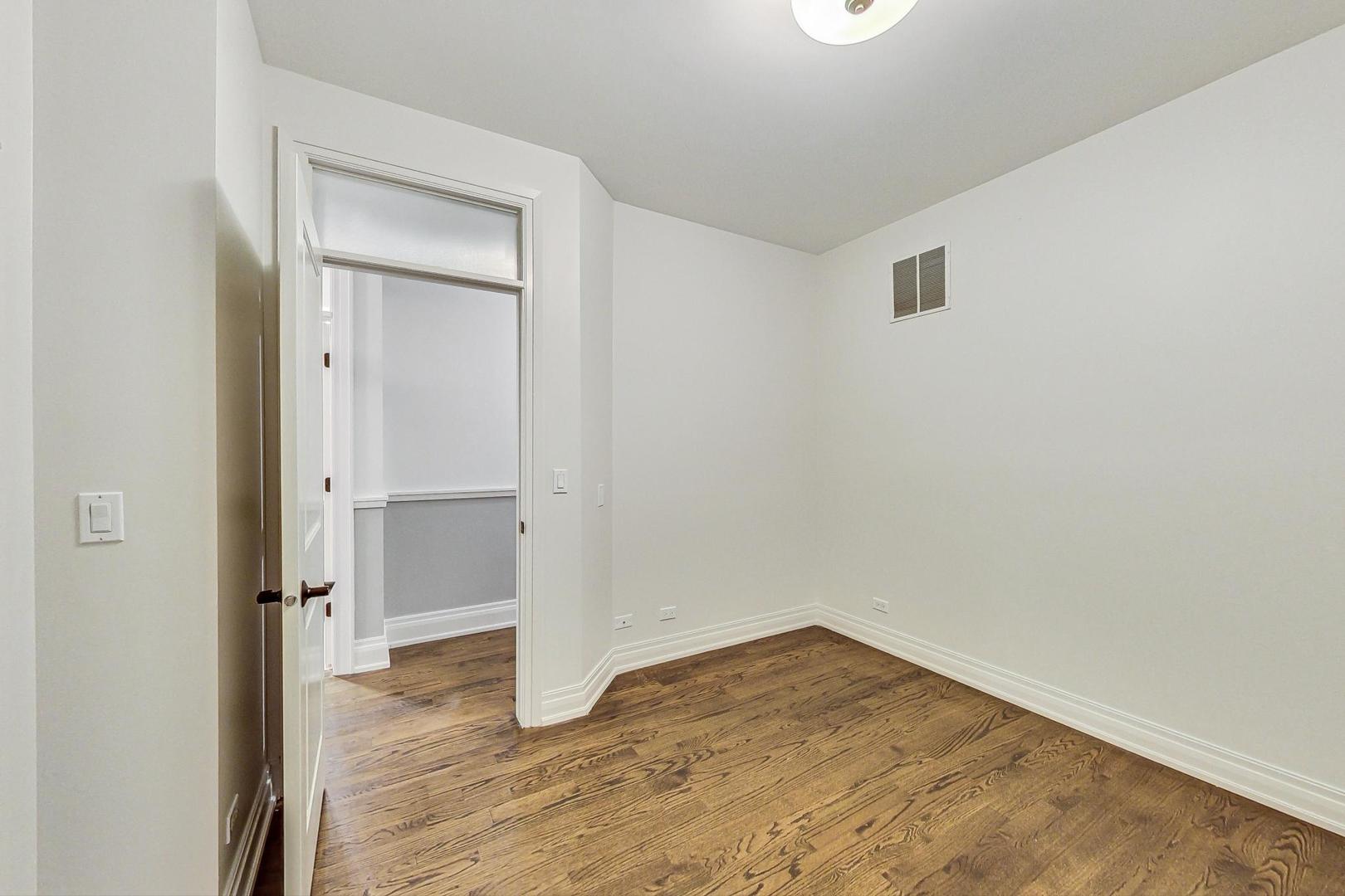 2848 North Sheffield Avenue, Unit 1N Chicago, IL 60657 - Photo 27 of 40 a view of empty room with wooden floor