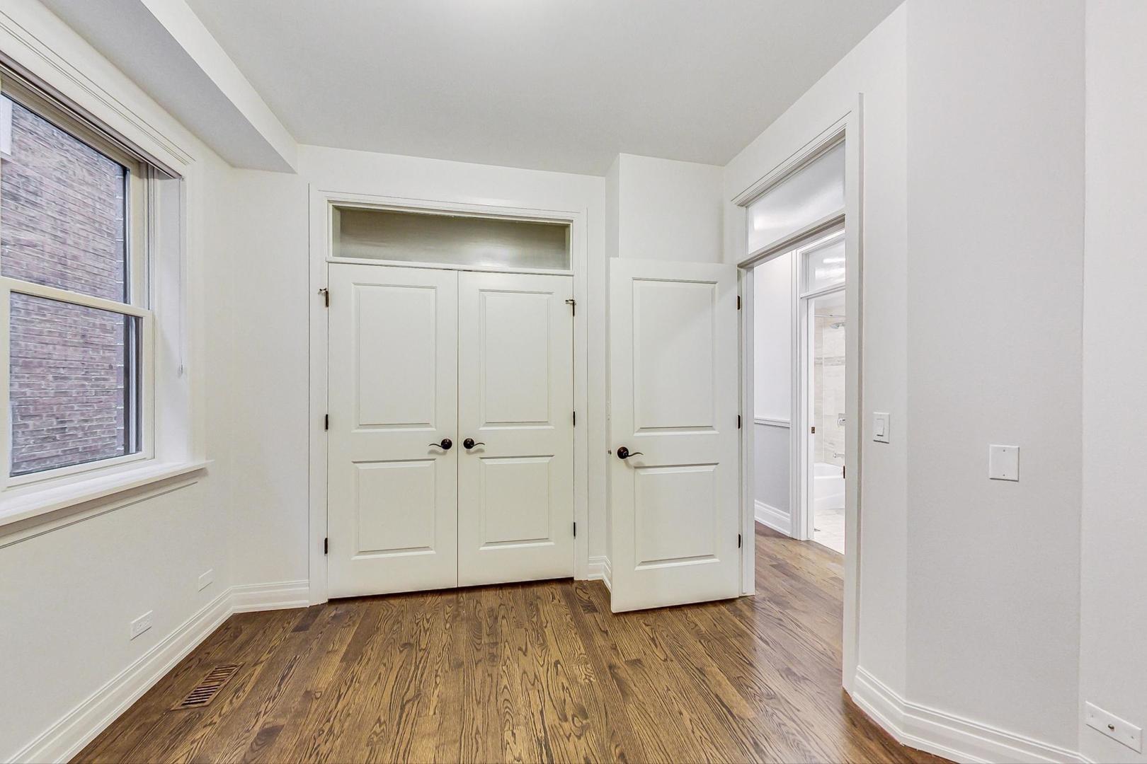2848 North Sheffield Avenue, Unit 1N Chicago, IL 60657 - Photo 28 of 40 a view of an empty room and wooden floor