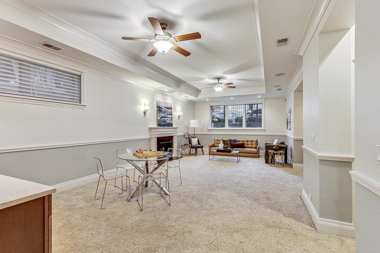 2848 North Sheffield Avenue, Unit 1N Chicago, IL 60657 - Photo 29 of 40 a view of a livingroom with furniture and a ceiling fan