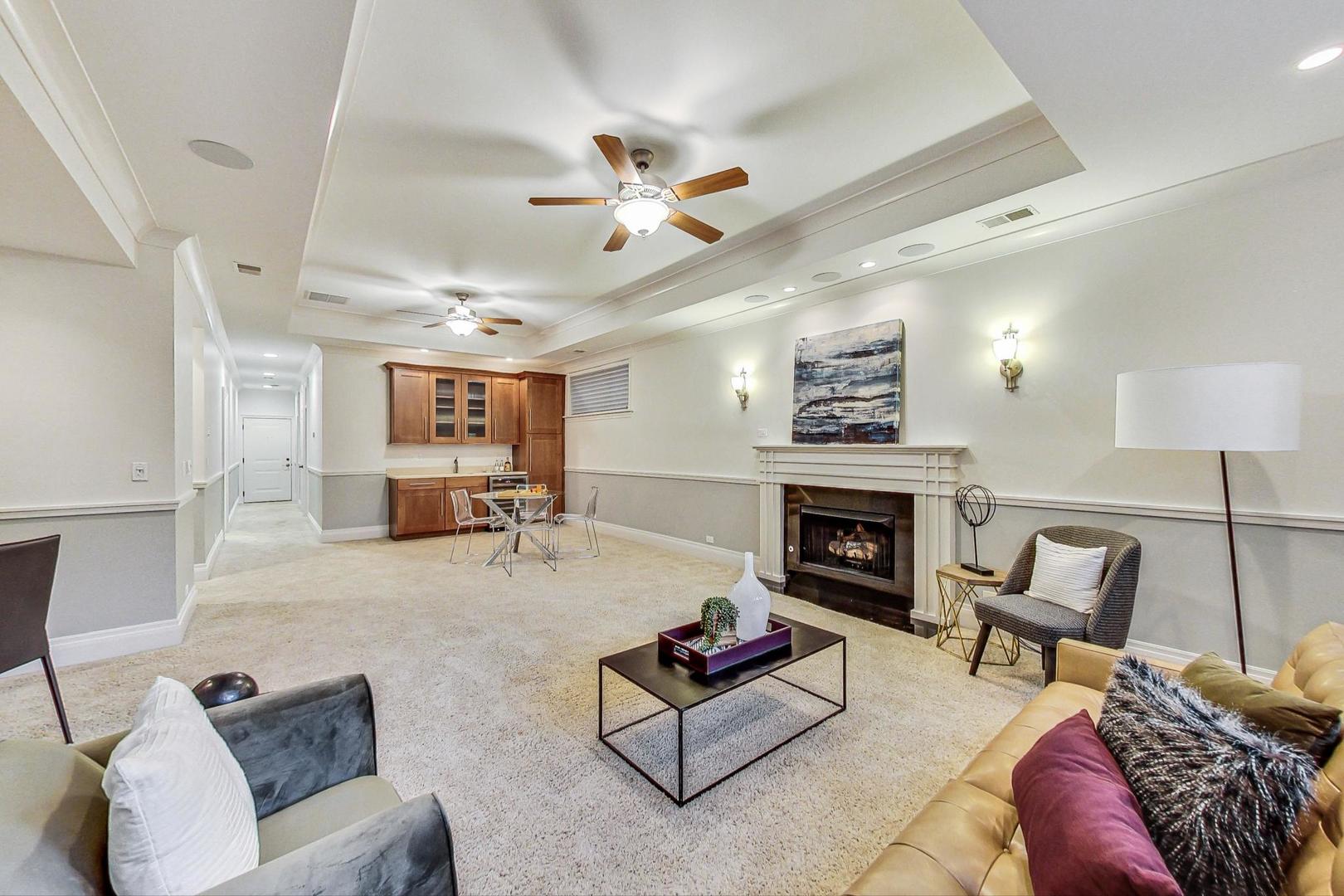 2848 North Sheffield Avenue, Unit 1N Chicago, IL 60657 - Photo 30 of 40 a living room with furniture and a fireplace