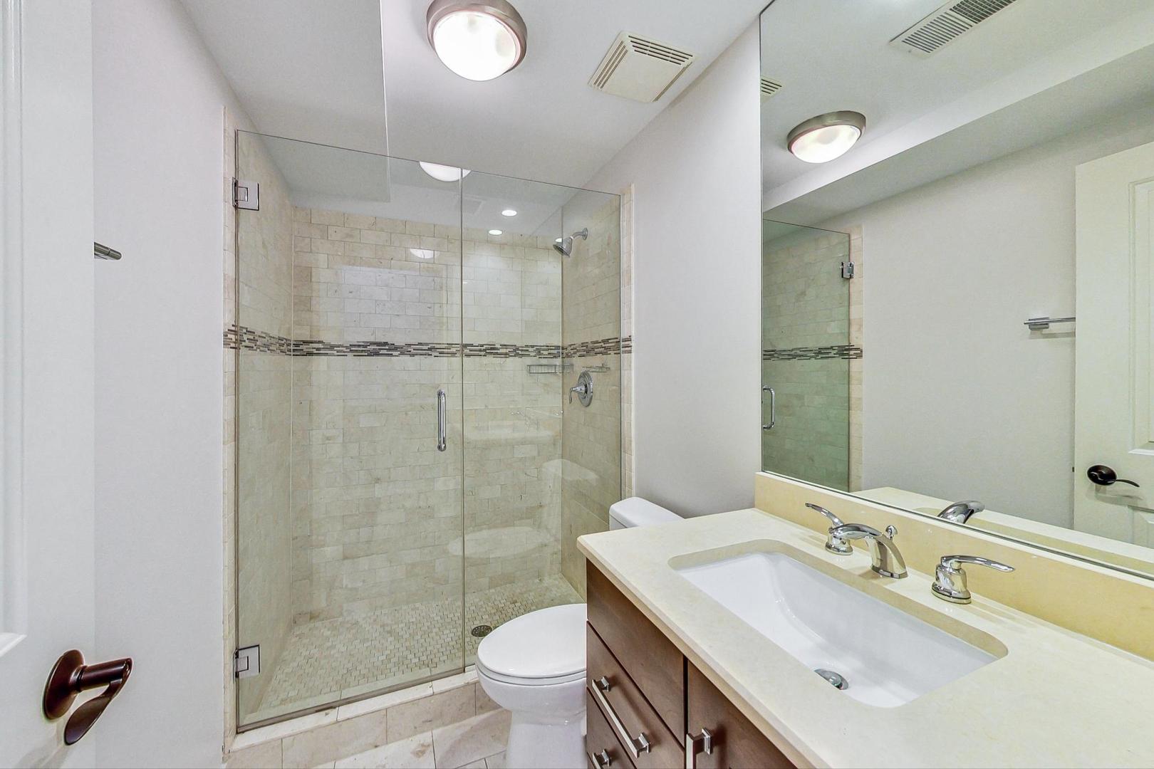 2848 North Sheffield Avenue, Unit 1N Chicago, IL 60657 - Photo 37 of 40 a bathroom with a sink toilet and shower