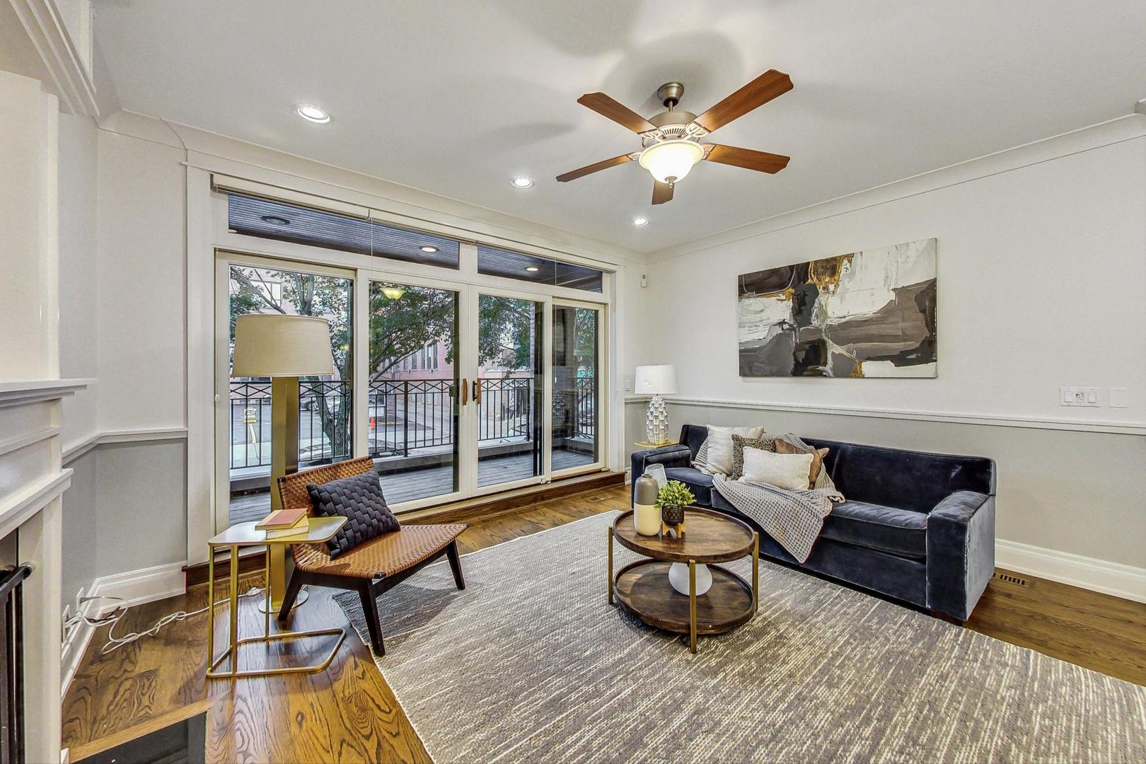 2848 North Sheffield Avenue, Unit 1N Chicago, IL 60657 - Photo 4 of 40 a living room with furniture and a large window