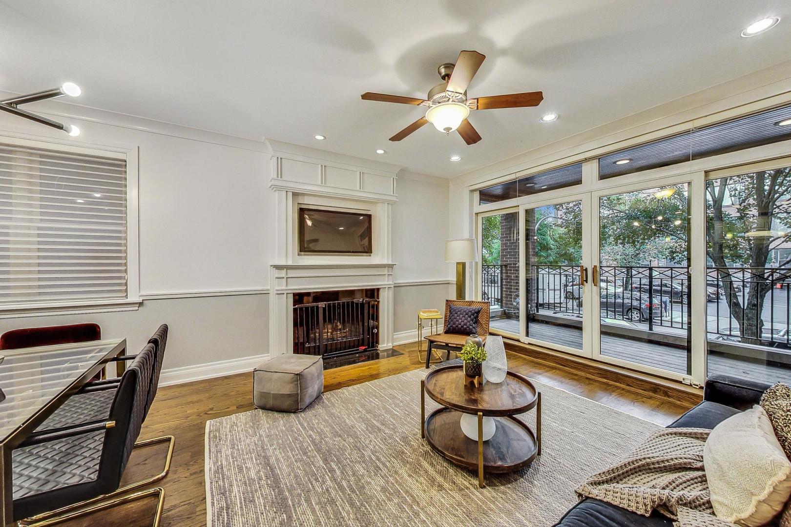 2848 North Sheffield Avenue, Unit 1N Chicago, IL 60657 - Photo 5 of 40 a living room with furniture and a fireplace