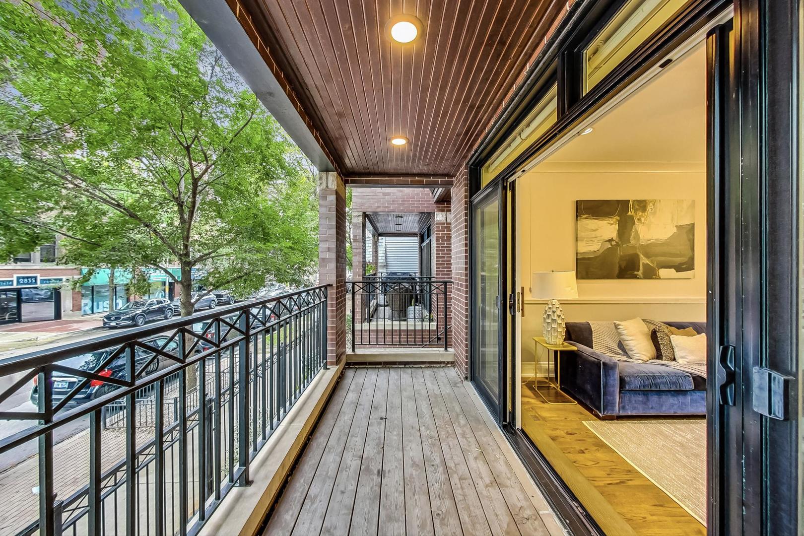 2848 North Sheffield Avenue, Unit 1N Chicago, IL 60657 - Photo 9 of 40 a view of a balcony with furniture