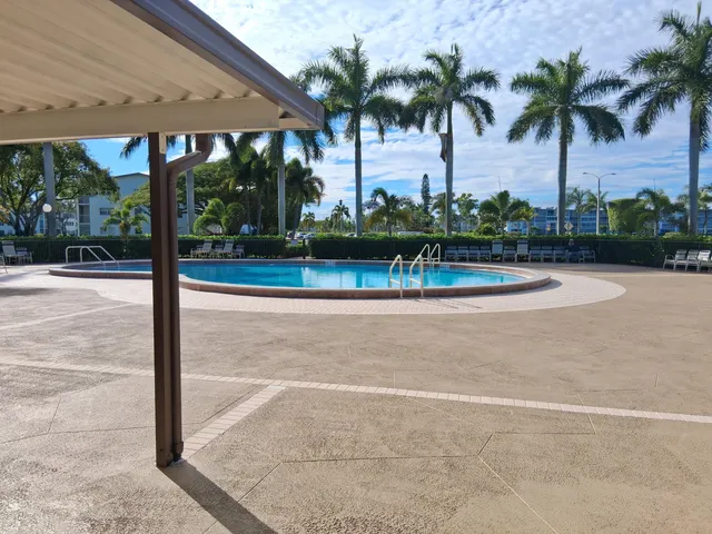 a view of a patio with a swimming pool