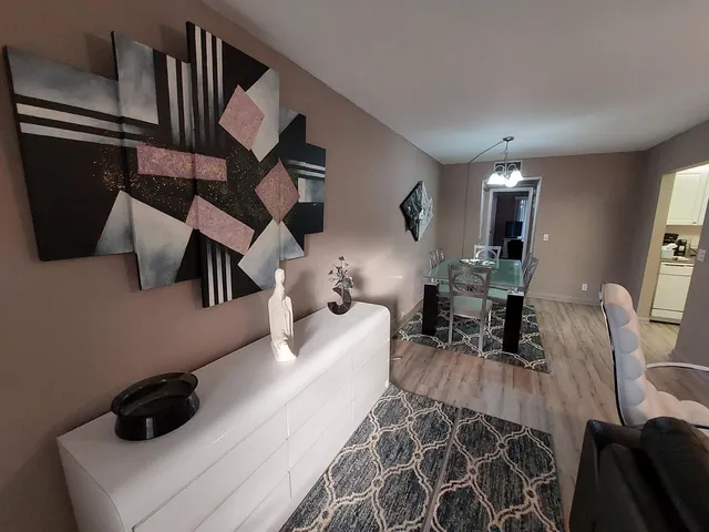 a bedroom with furniture and a mirror