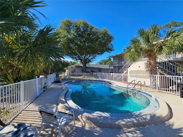 a view of a swimming pool with a patio