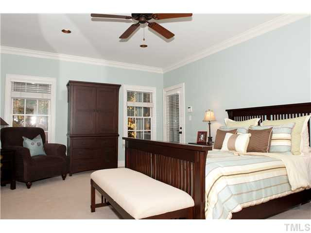5801 Orchid Valley Road Raleigh, NC 27613 - Photo 10 of 25 Huge first floor master includes fresh paint, new carpet, new ceiling fan, his & hers walk in closets. Updated bathroom with brand new oil rubbed bronze shower surround and plumbing/bathroom fixtures. New TOTO toilet. Private access to screen porch. Master Bedroom