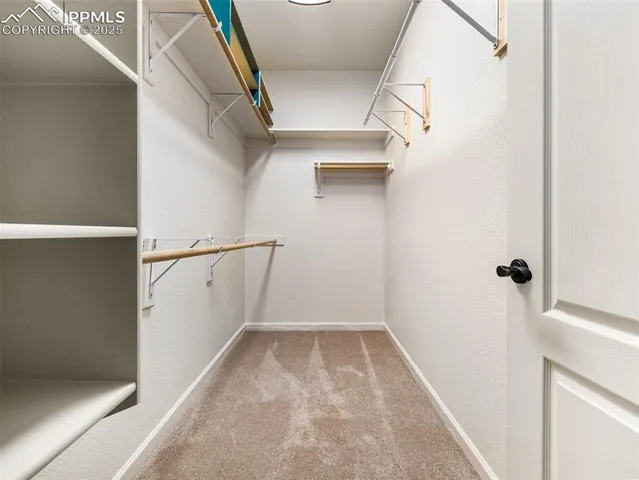 an empty room with fan and a ceiling fan