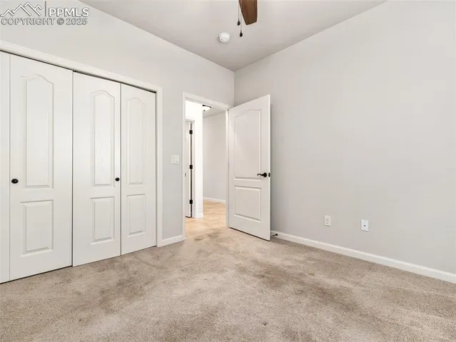 a bathroom with a granite countertop sink toilet mirror and shower