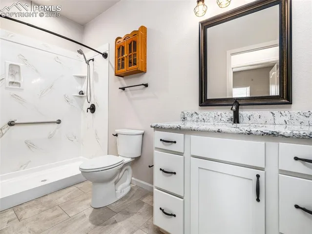a view of a kitchen with a sink and a fireplace