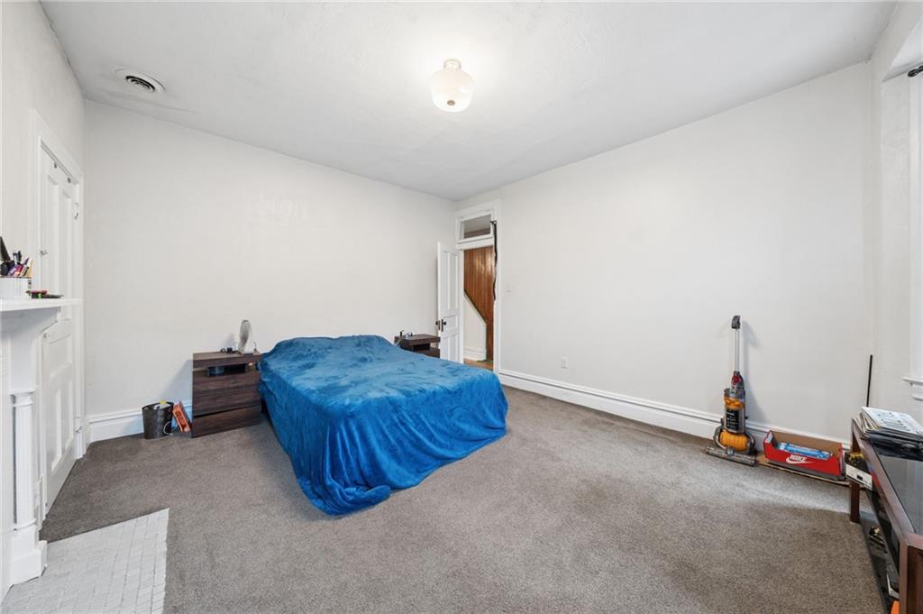 1523 Evergreen Road Pittsburgh, PA 15209 - Photo 25 of 35 a room with a couch and gym equipment