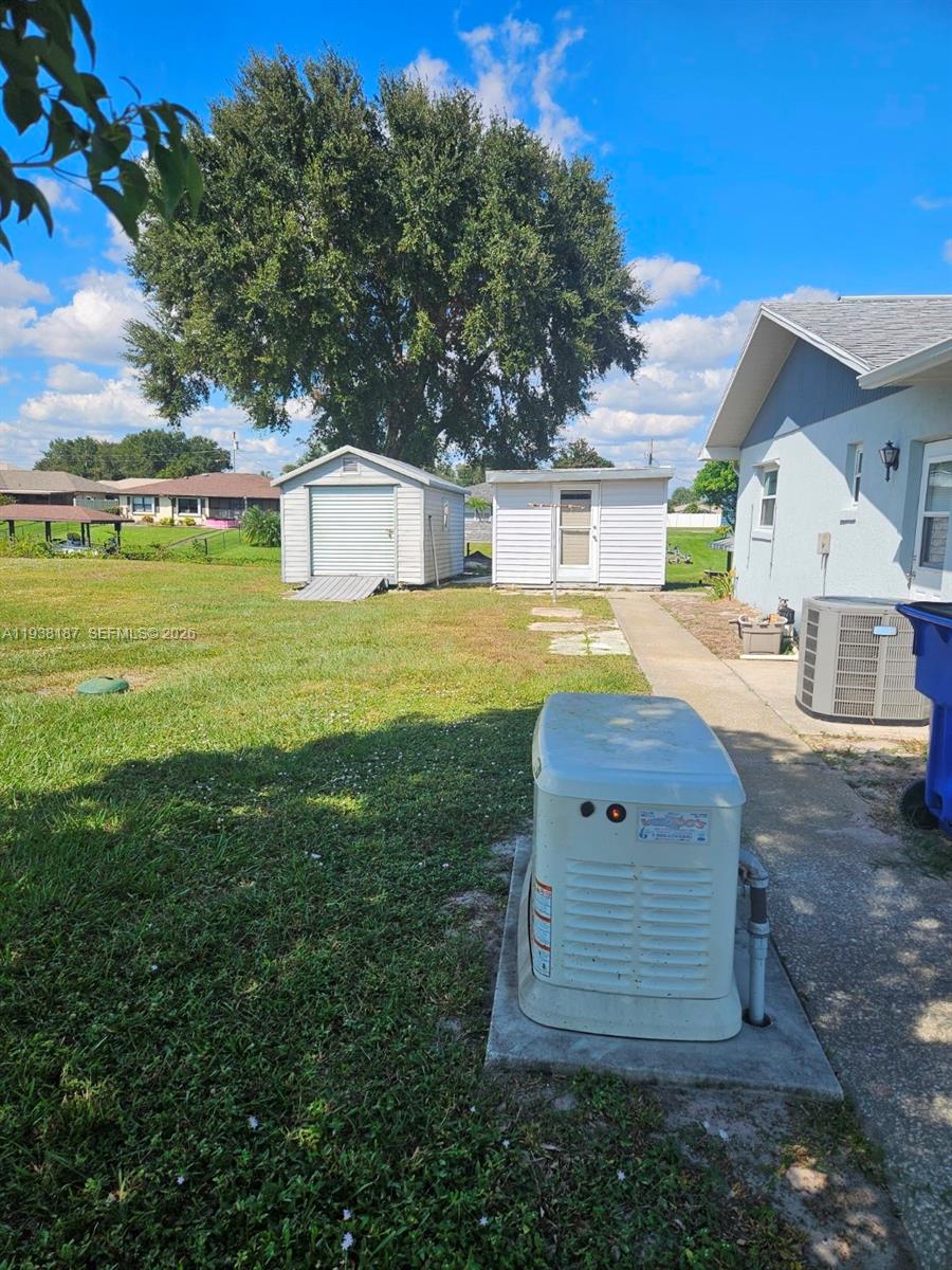 126 Citrus Road Northeast Lake Placid, FL 33852 - Photo 19 of 25 a view of a house with a yard