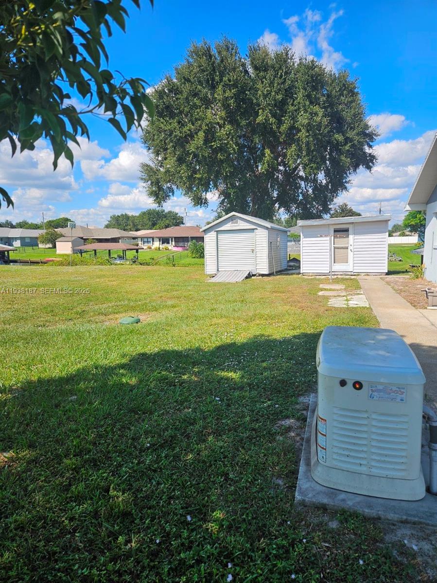 126 Citrus Road Northeast Lake Placid, FL 33852 - Photo 20 of 25 a view of a house with a yard