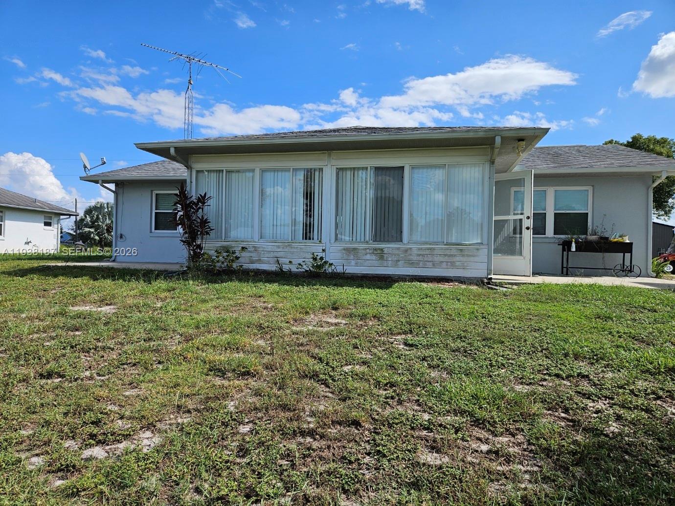 126 Citrus Road Northeast Lake Placid, FL 33852 - Photo 2 of 25 a view of a house with a yard