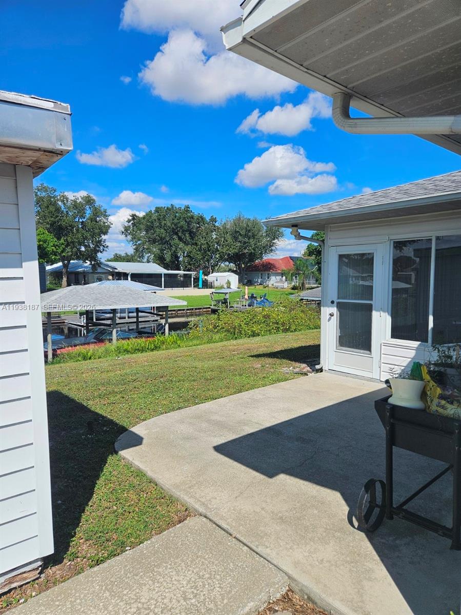 126 Citrus Road Northeast Lake Placid, FL 33852 - Photo 21 of 25 a view of a house with a yard