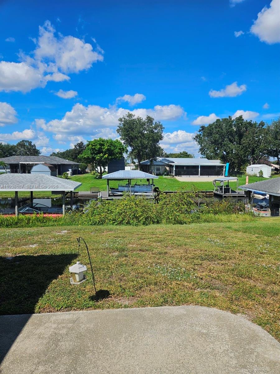 126 Citrus Road Northeast Lake Placid, FL 33852 - Photo 22 of 25 a view of a big yard next to a yard