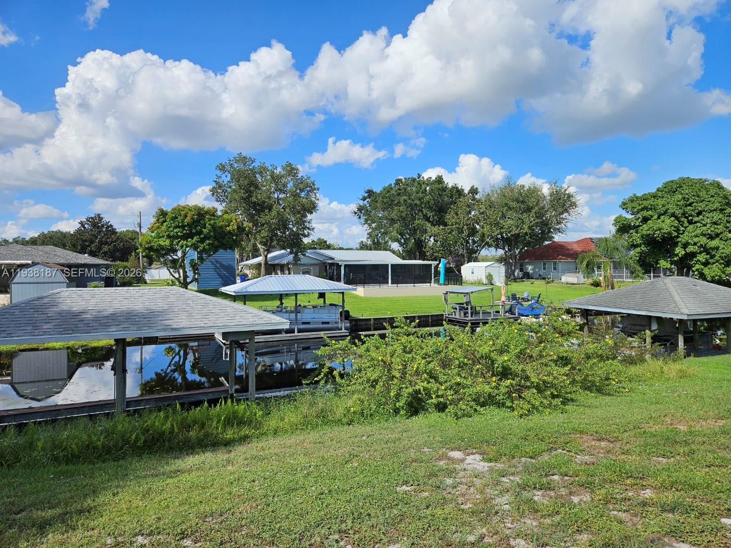 126 Citrus Road Northeast Lake Placid, FL 33852 - Photo 4 of 25 an aerial view of a house with yard table and chairs