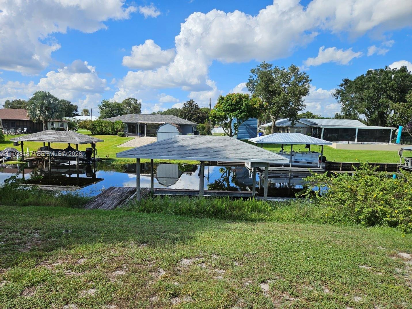 126 Citrus Road Northeast Lake Placid, FL 33852 - Photo 6 of 25 a view of an house with backyard space and sitting area