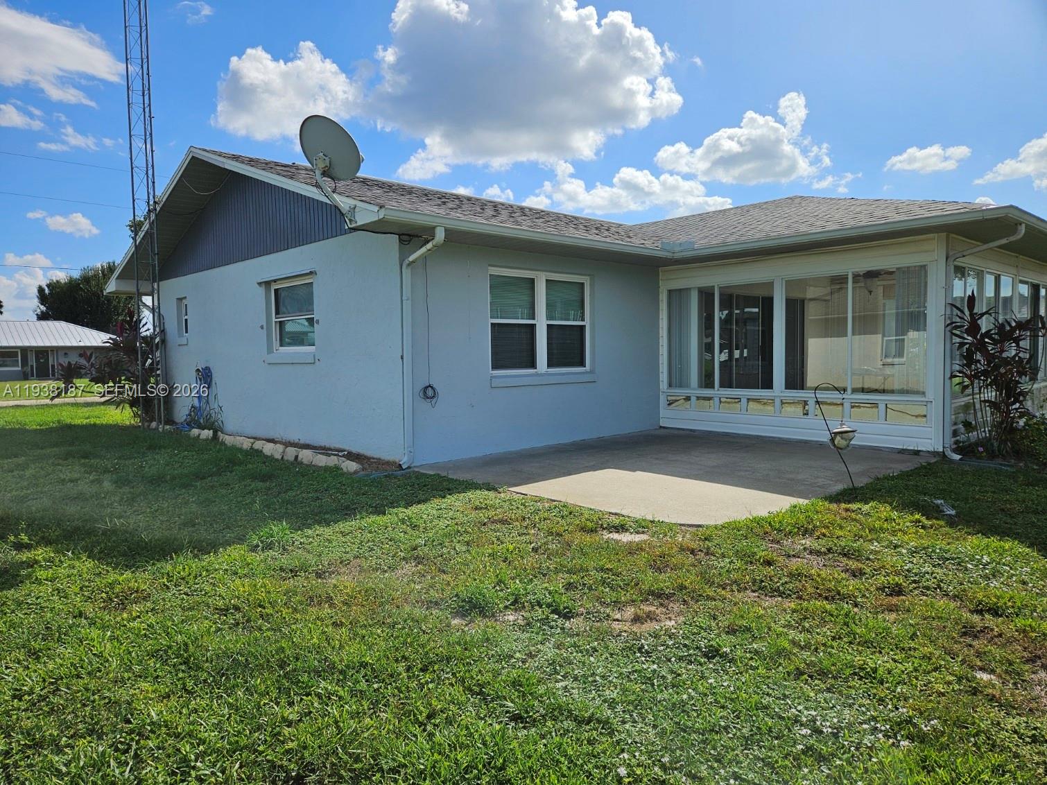 126 Citrus Road Northeast Lake Placid, FL 33852 - Photo 7 of 25 a view of a house with a backyard