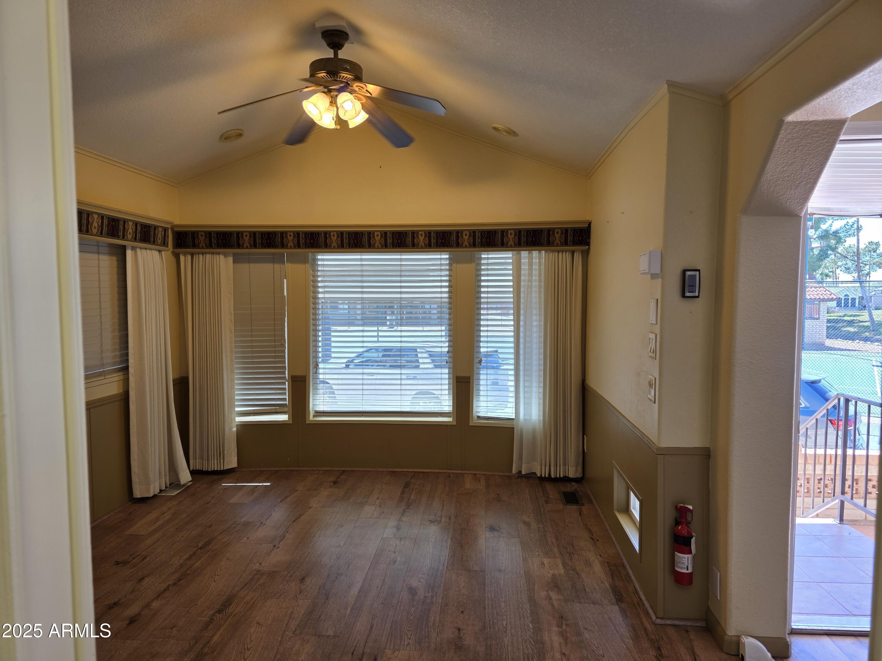 2359 East Pima Avenue Apache Junction, AZ 85119 - Photo 11 of 24 a very nice looking room with wooden floor and a window