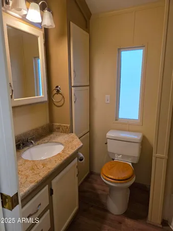 a bedroom with a bed and a mirror