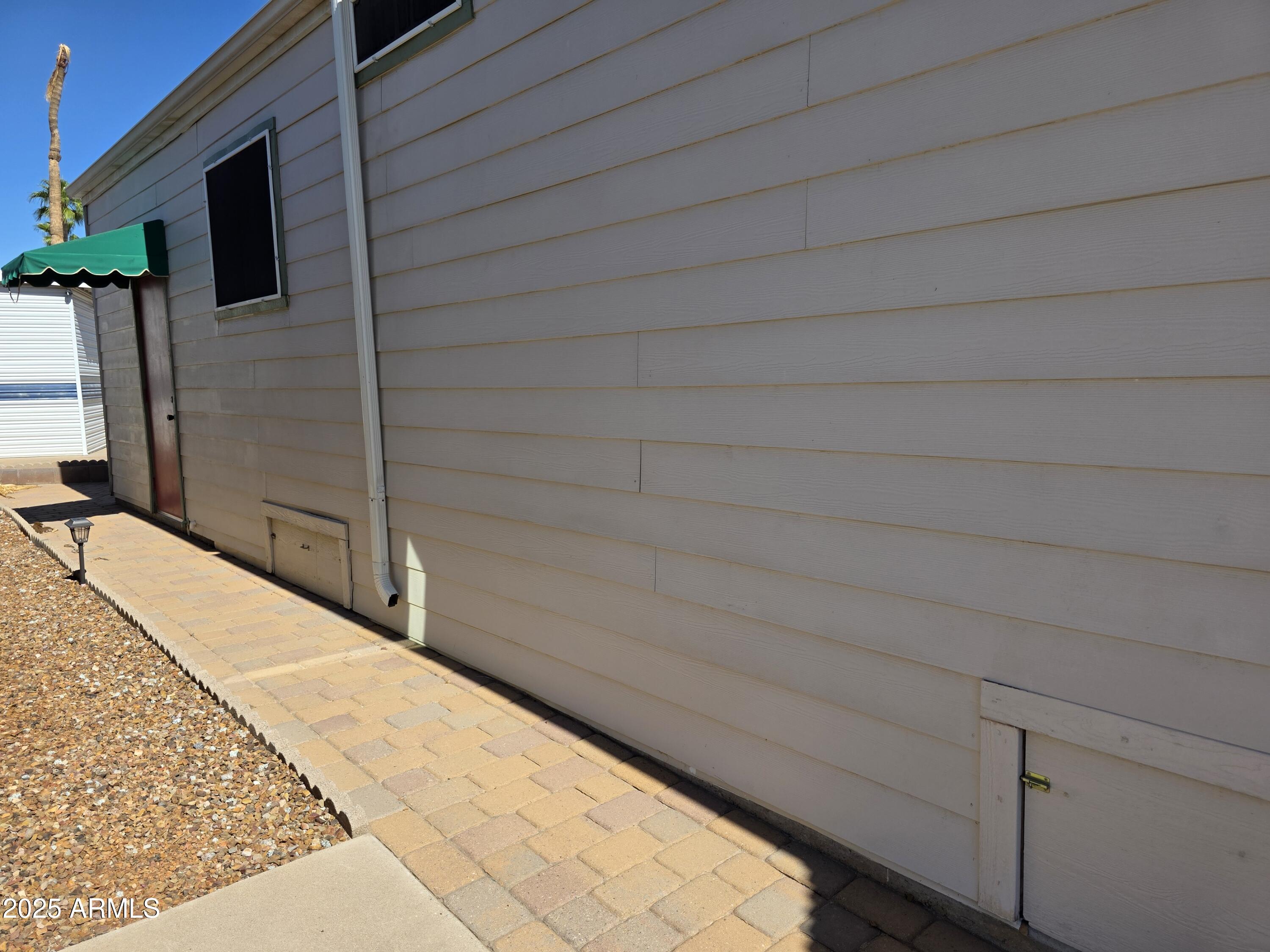 2359 East Pima Avenue Apache Junction, AZ 85119 - Photo 23 of 24 a potted plant sitting on the roof of a house