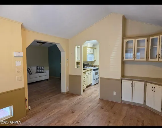 a view of a house with wooden floor and a window