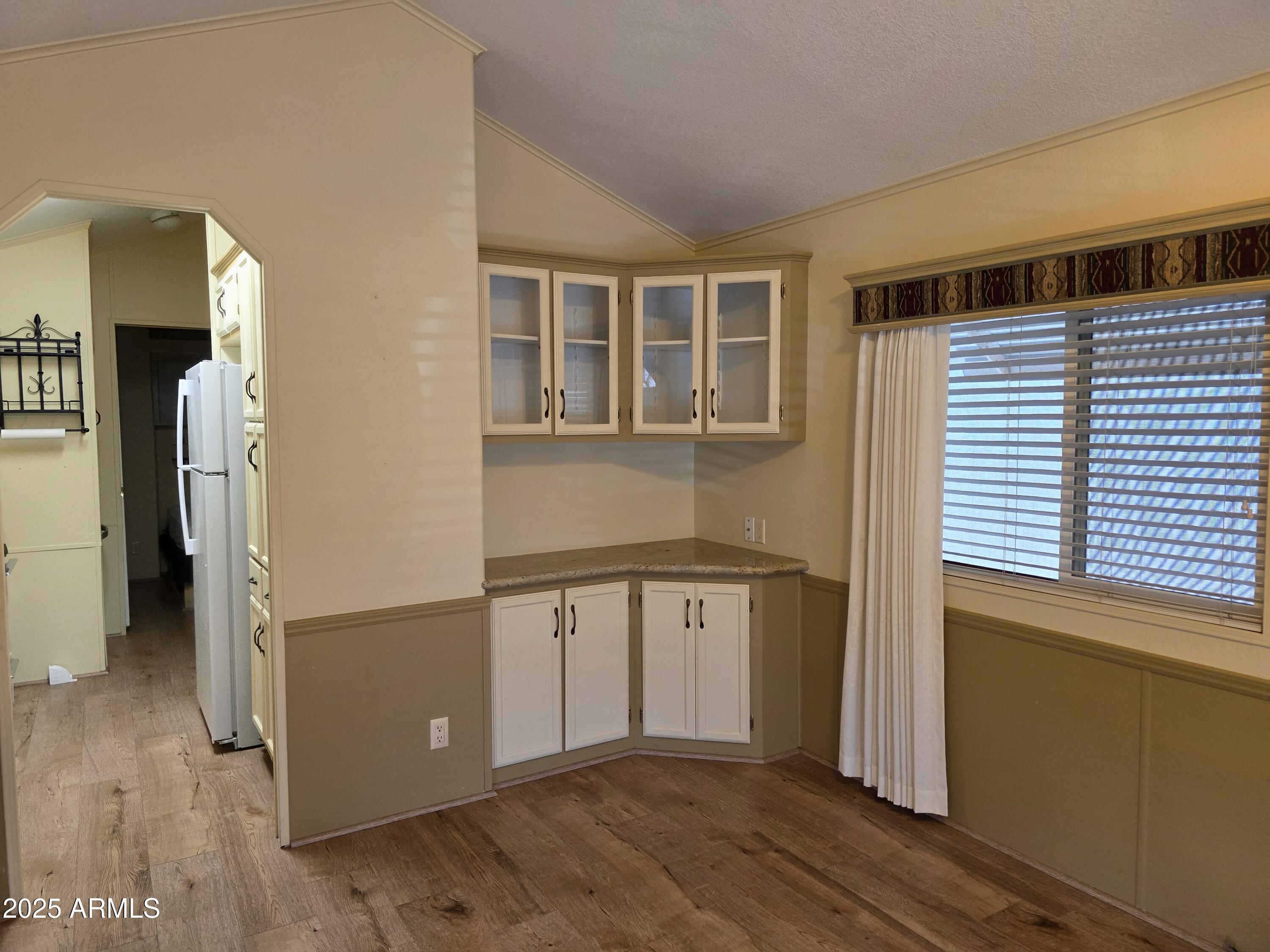 2359 East Pima Avenue Apache Junction, AZ 85119 - Photo 10 of 24 a view of a house with wooden floor and a window