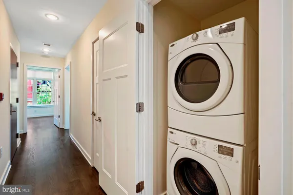a view of a hallway with washer and dryer