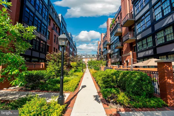 a view of pathway with building in the background