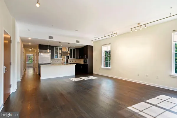 a view of kitchen with cabinets and wooden floor