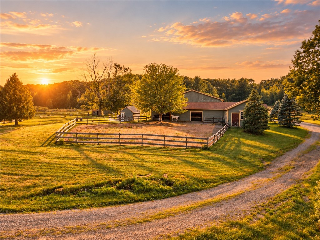 The approximately 3,000-square-foot barn opens directly to a securely fenced paddock, creating a convenient setup for turnout, feeding and daily horse care.